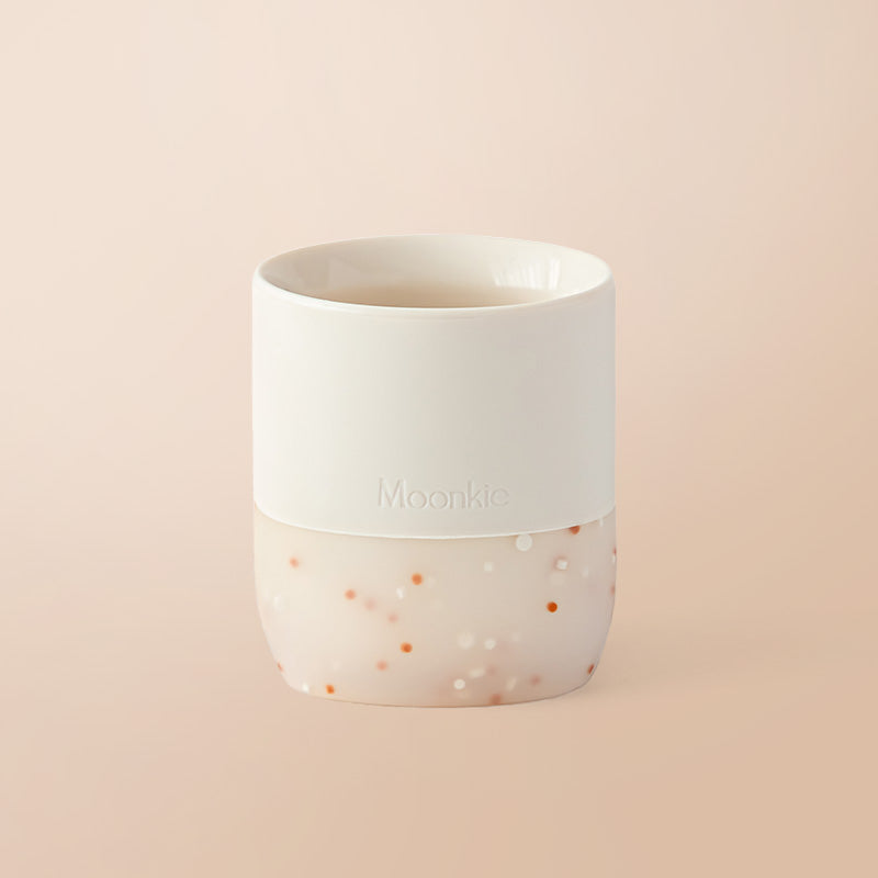 Baltas su rožiniu silikoninis puodelis